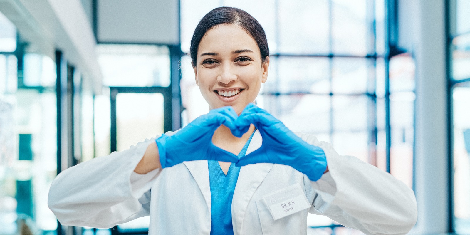 Doctor making the shape of a heart with her hands