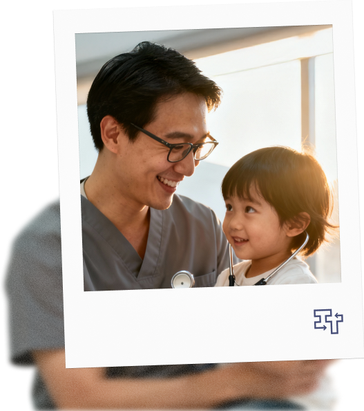 image of medical professional holding a child