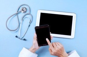 Doctor working with smartphone